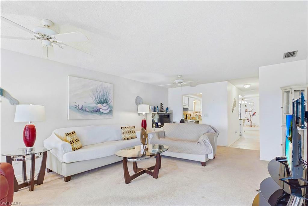 The generous layout offers flexible space for lounging, entertaining, or a home office setup