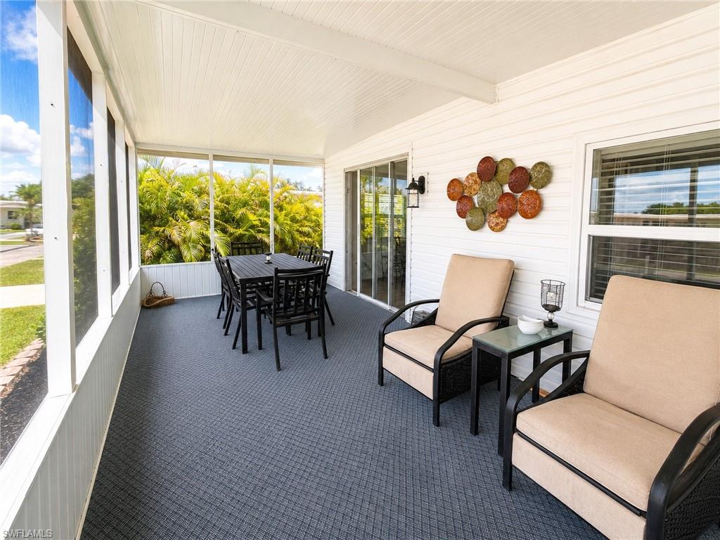 Screened-in porch with a textured floor and a white paneled ceiling