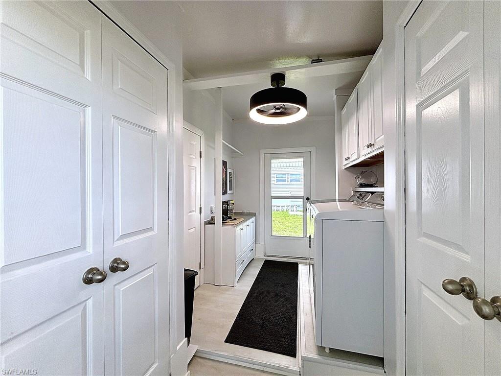 Screened porch featuring a textured ceiling, a carpeted floor, and exterior wall siding