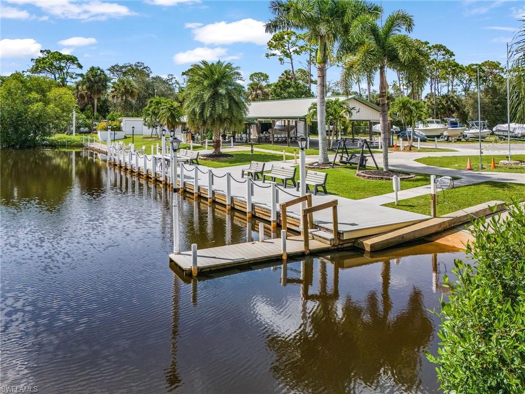 Waterfront dockage featuring a fixed wooden dock and floating dock