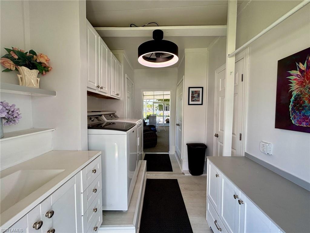 Waterfront community featuring multiple boat slips, boat storage, and direct water access