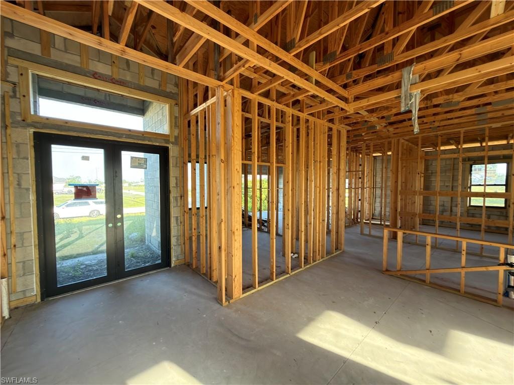 Interior framing showcasing new construction, featuring exposed wooden beams and concrete block walls