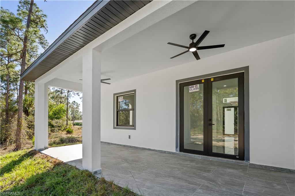 Covered outdoor patio featuring a neutral-toned tile floor
