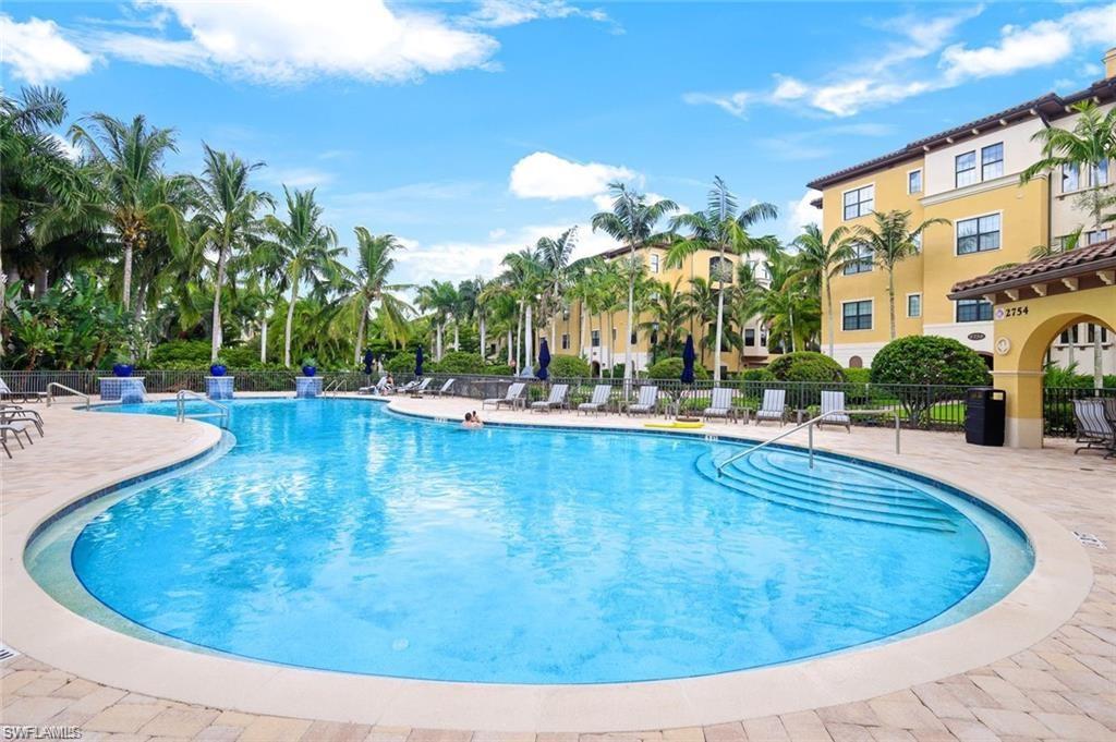 Community pool with a patio