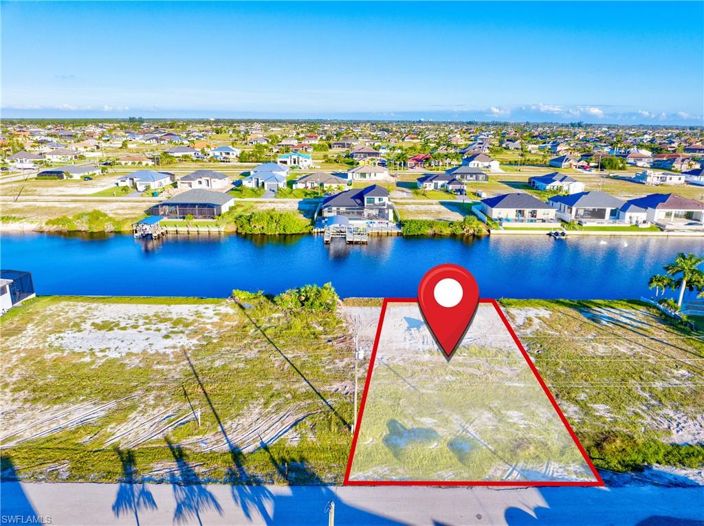 Waterfront lot featuring direct canal access, a clear building envelope, and a street-facing orientation