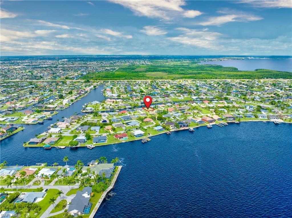 Aerial perspective showcasing a residential area with extensive canal frontage