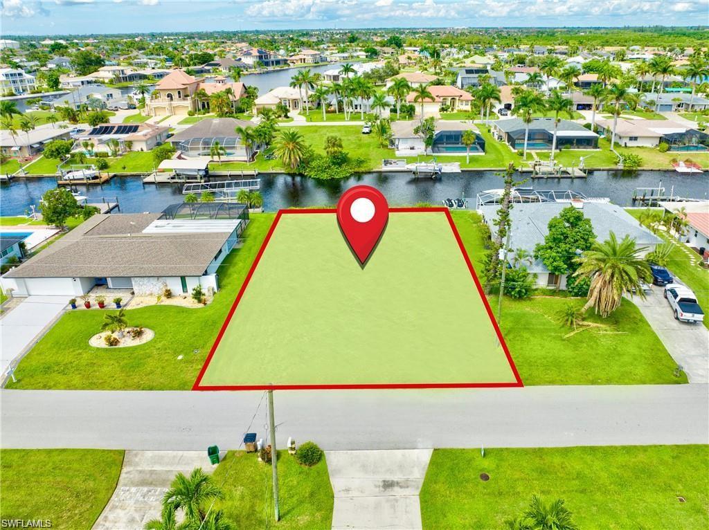 Vacant land parcel featuring canal frontage with a clear boundary outline