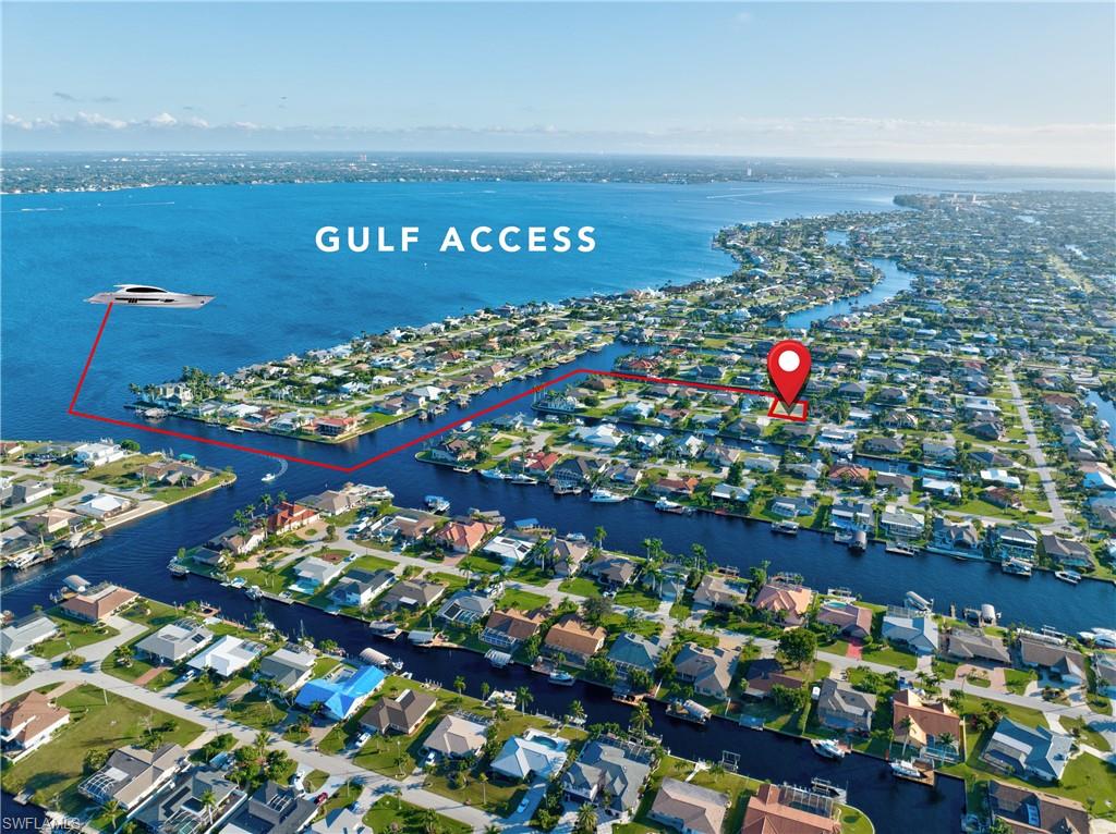 Aerial perspective showcasing a waterfront community with direct Gulf access