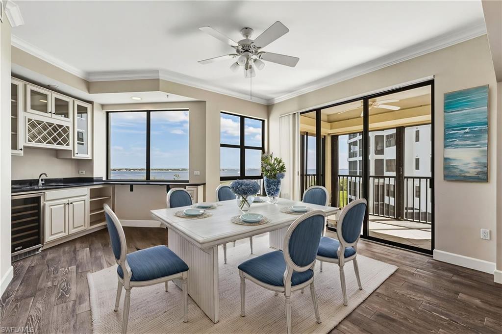 From this vantage point, the views are truly breathtaking. A beautifully appointed wet bar features a wine cooler, wine rack, granite countertops, and ample overhead storage.Virtually Staged room.