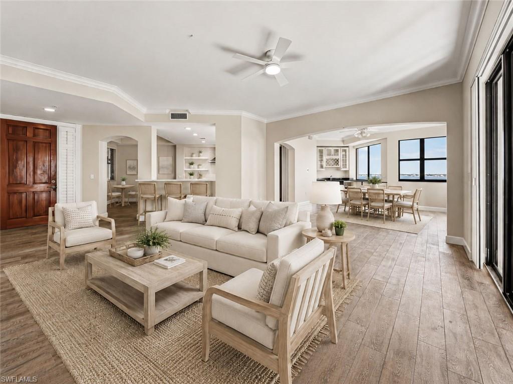 Sweeping views of the Caloosahatchee River can be enjoyed from every vantage point within this open-concept floor plan, complemented by beautiful plank tile flooring throughout.Virtually Staged versatile main living area.