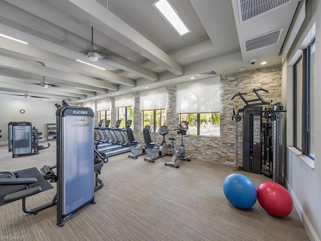 Workout area with carpet floors and ceiling fan