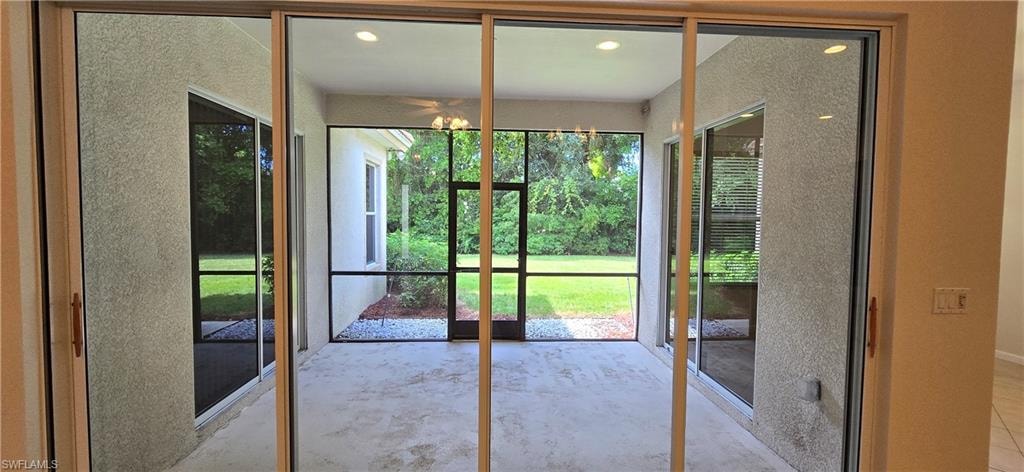 Screened Lanai accessible from Kitchen, Living Room & Primary Bedroom.