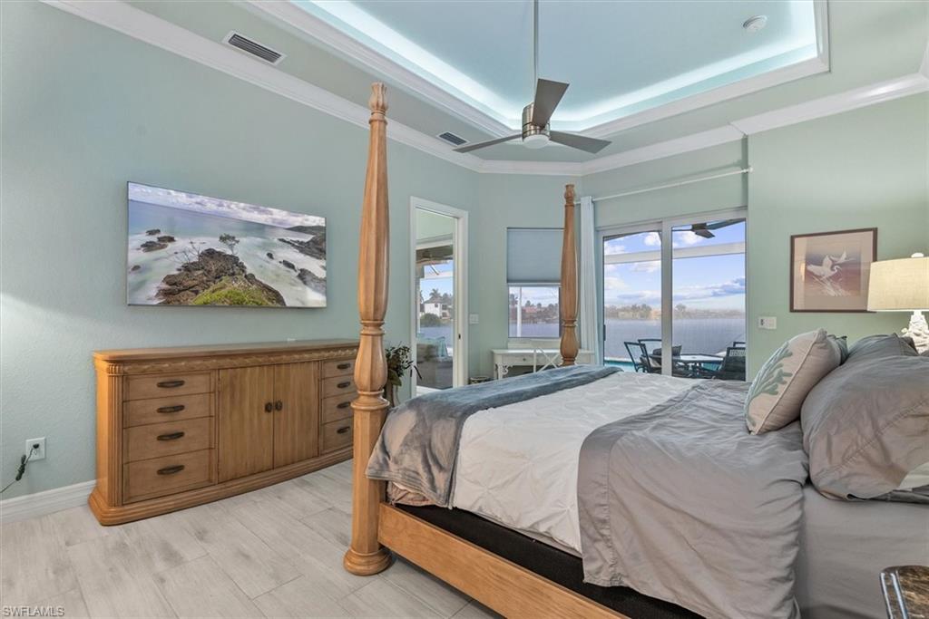 Tray ceiling with recessed lighting and crown molding
