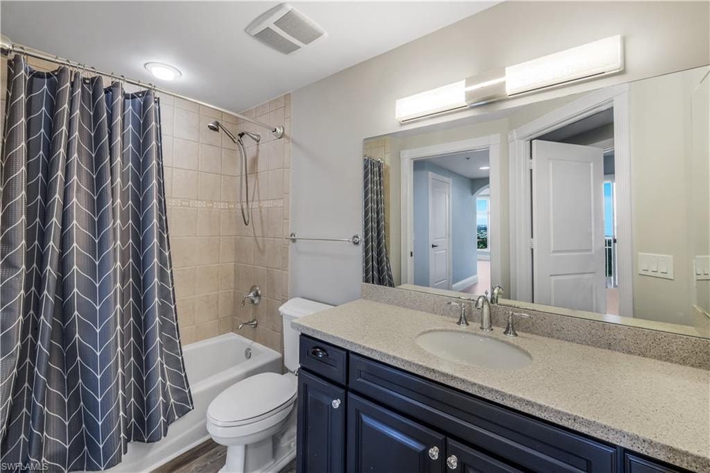 Bathroom featuring a dark wood vanity with a light speckled countertop, undermount sink, and chrome faucet. "Jack & Jill" accessible from Bedroom #3 or from hallway outside of den.