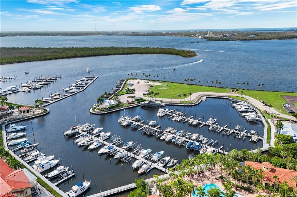 Expansive marina setting featuring multiple boat slips with direct Gulf access