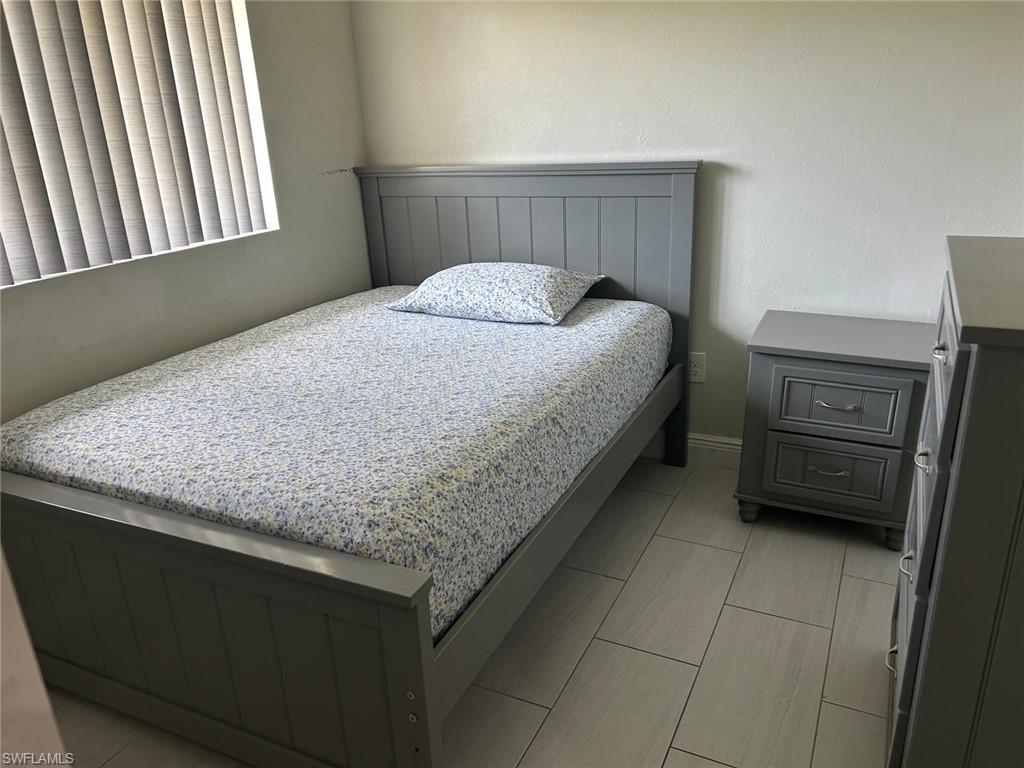 Light-toned flooring featuring rectangular tile