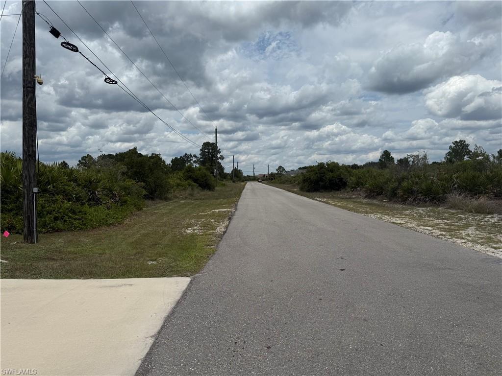 Paved road frontage with an adjacent concrete pad