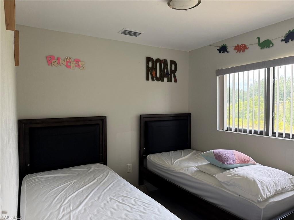 Bright interior space with light-colored walls and dark wood-finish flooring