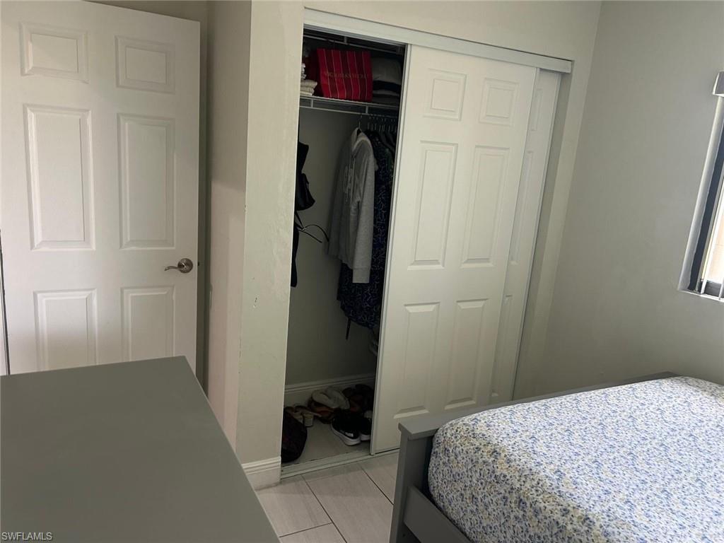 Sliding closet doors with interior shelving and hanging space