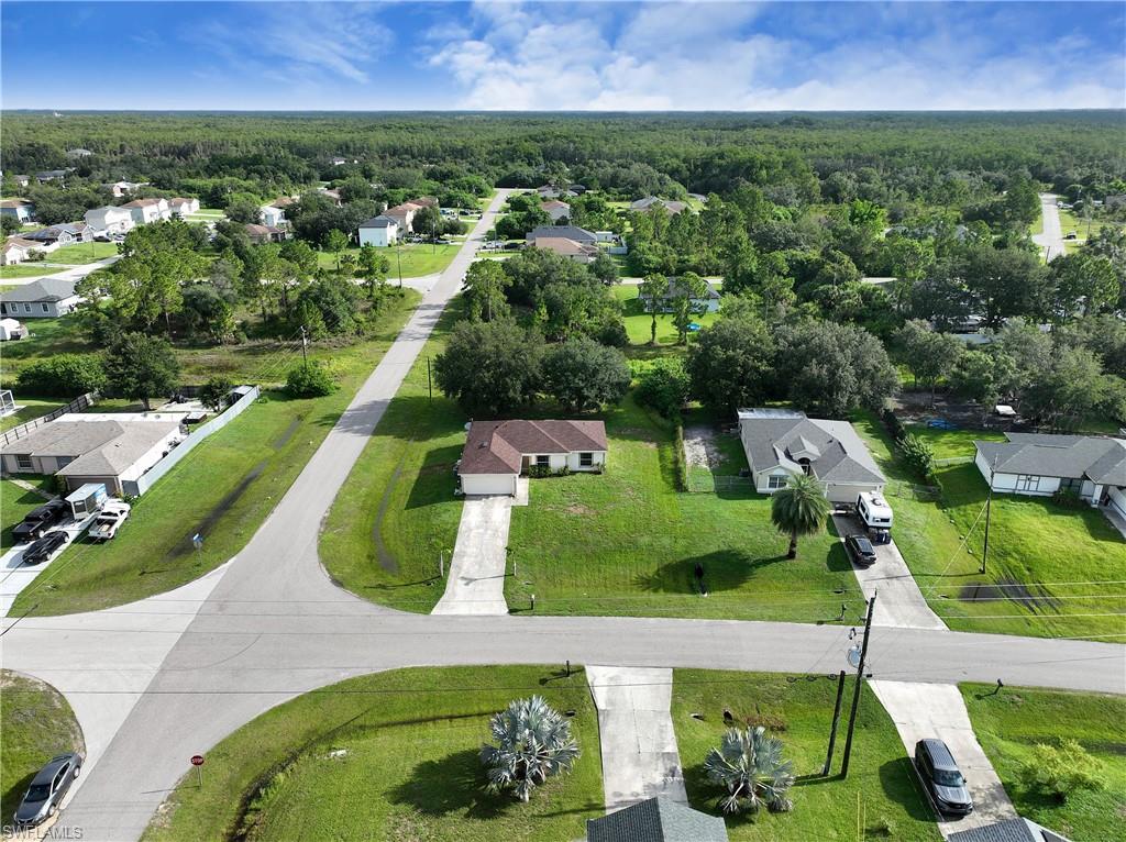 Residential neighborhood featuring paved roadways and mature trees