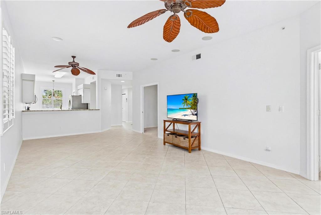 The spacious living room is the heart of the home, offering an open and inviting setting that's perfect for entertaining guests or enjoying a relaxing evening after a day on the golf course.