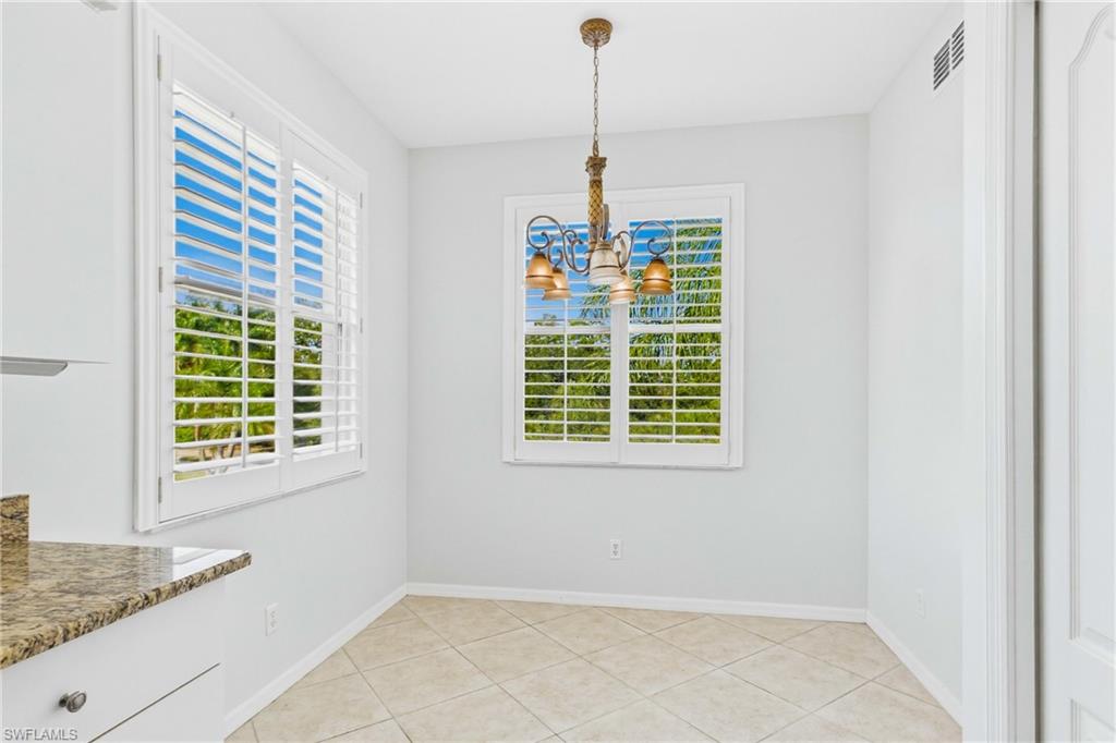 Start your day in this bright and inviting breakfast nook, the perfect spot to enjoy your morning coffee while taking in peaceful views and abundant natural light.