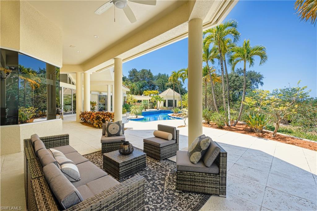 View of patio with ceiling fan and outdoor lounge area
