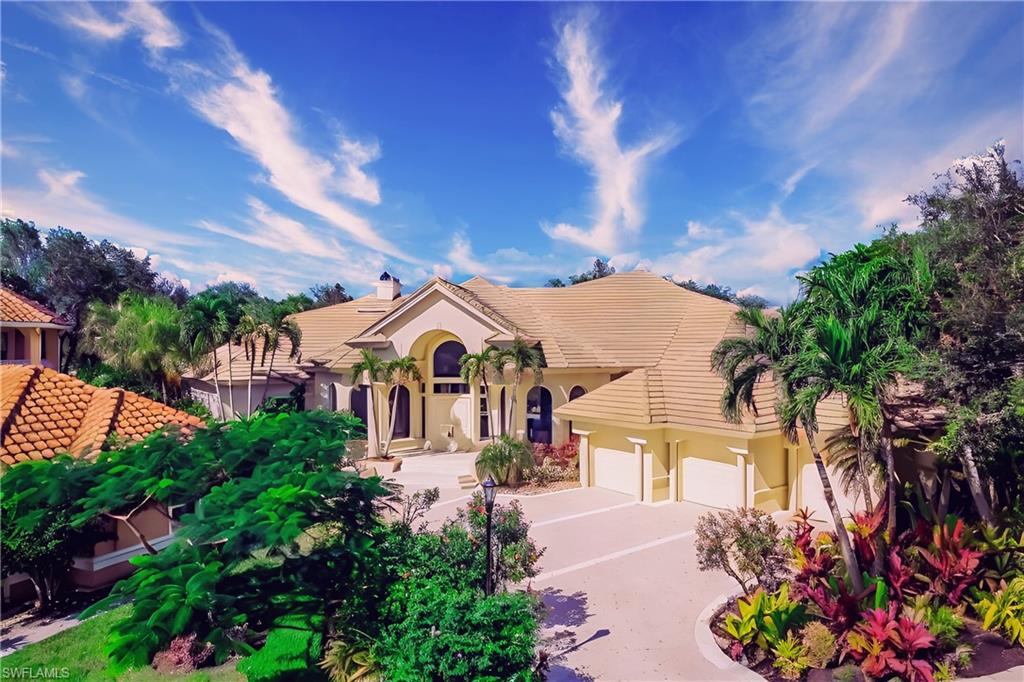 Mediterranean / spanish home featuring a garage
