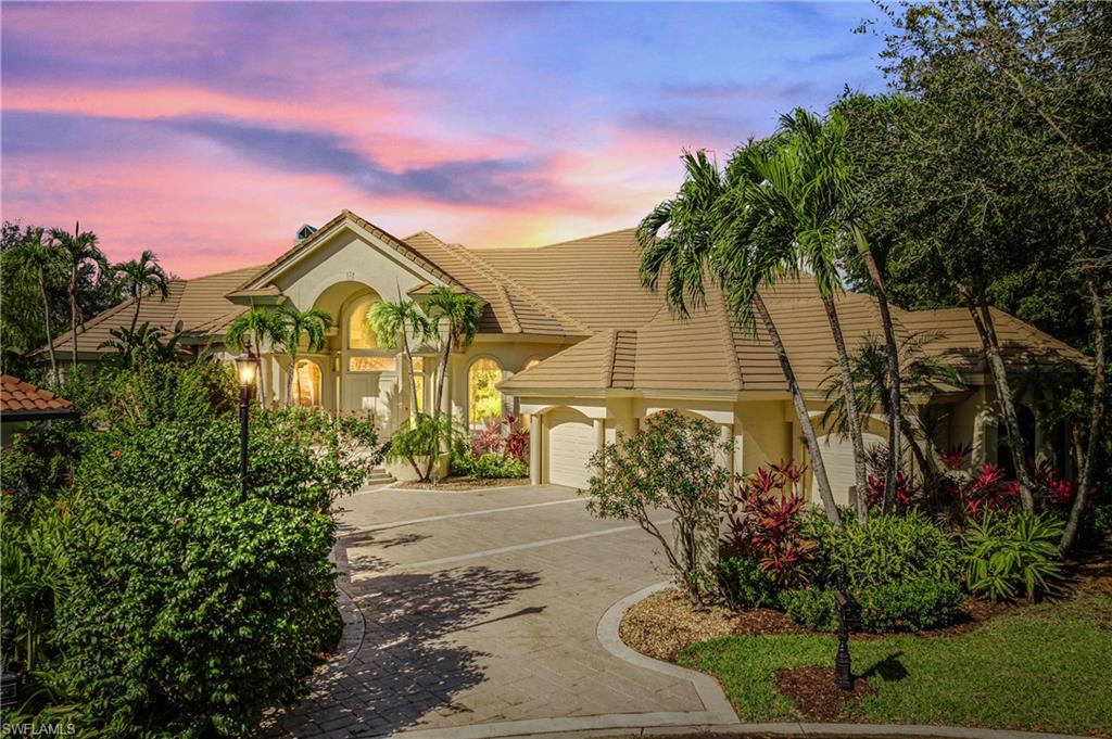Mediterranean / spanish-style house featuring a garage