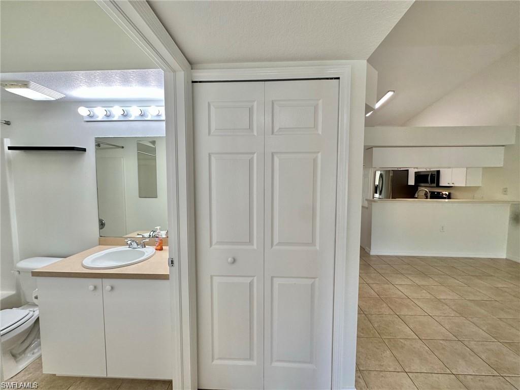 Bathroom vanity with an integrated sink and light-colored countertop