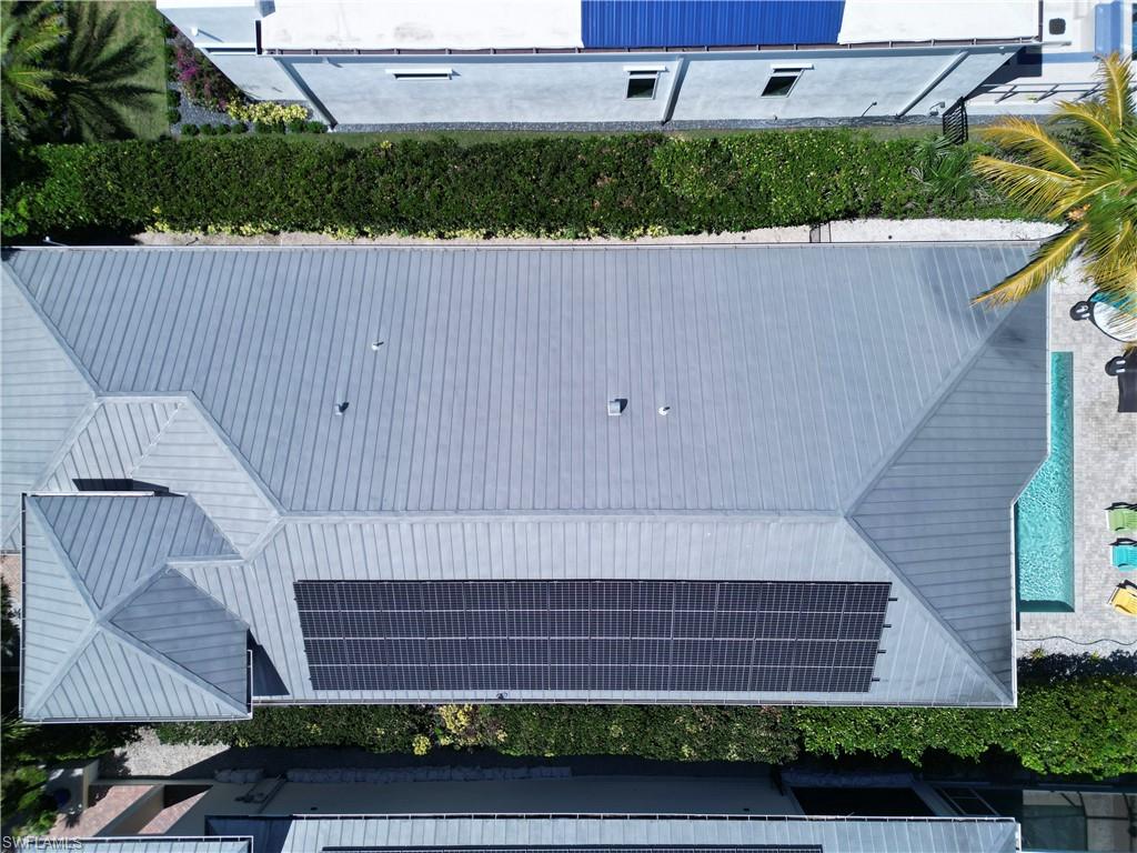 Metal seam roof with integrated solar panel array