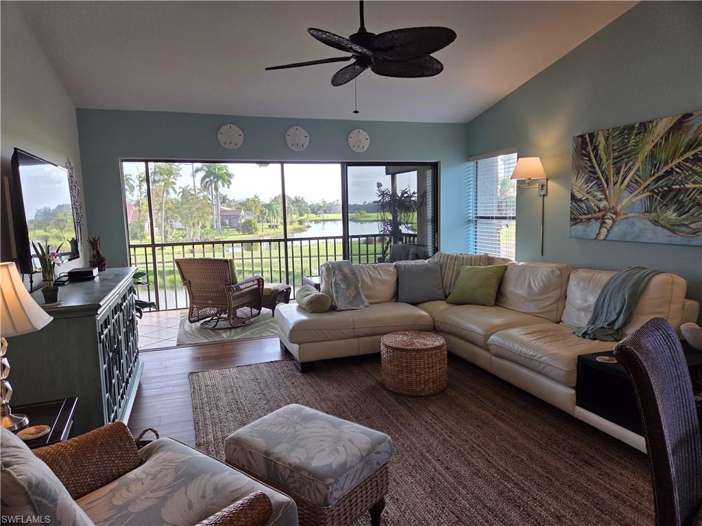Living area with wood-finish flooring and light blue walls