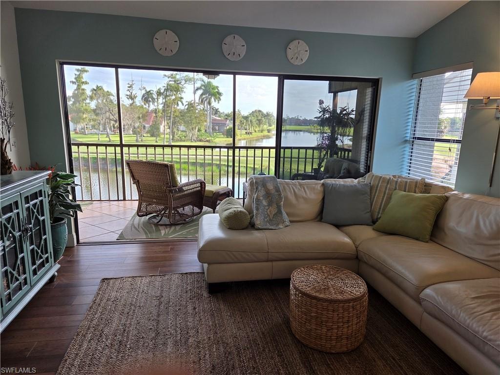 Expansive screened balcony overlooking a tranquil water feature