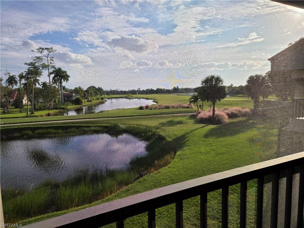 Expansive golf course and water feature vista from a private balcony