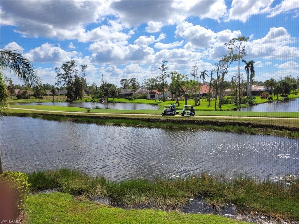 Expansive water features and manicured greens define this outdoor landscape