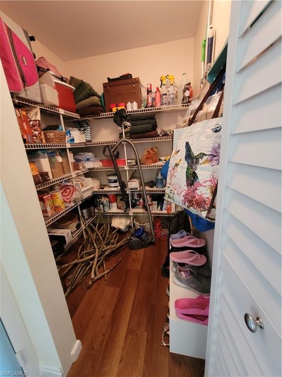 Large walk in pantry at the end of the kitchen by the entry door.
