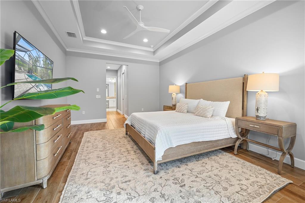 Tray ceiling with recessed lighting and crown molding