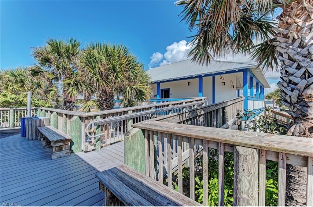 Wood-finish boardwalk with integrated seating and railings