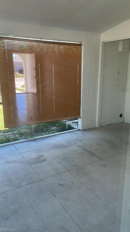 Tiled flooring and white paneled walls define this interior space