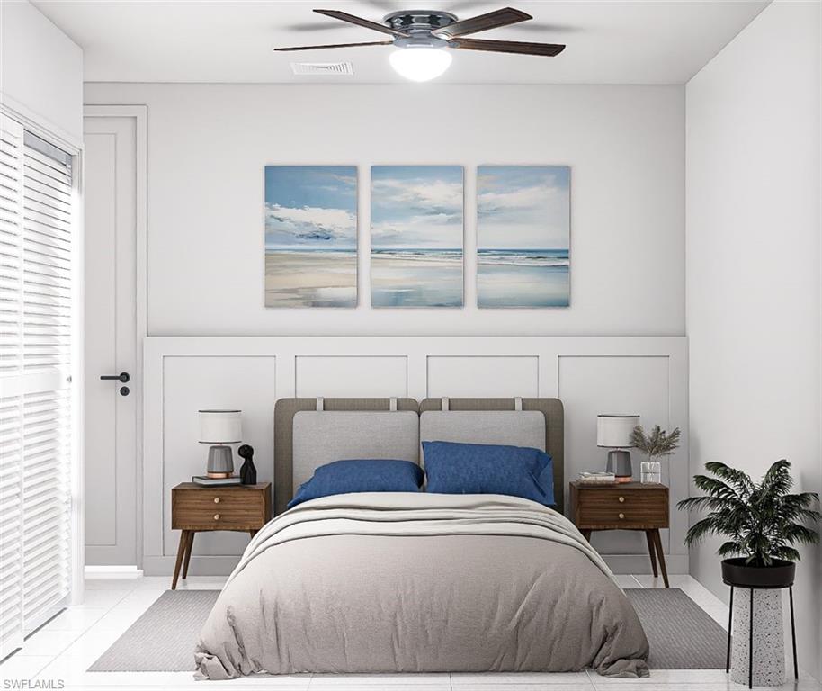 Bedroom featuring a decorative wall and ceiling fan