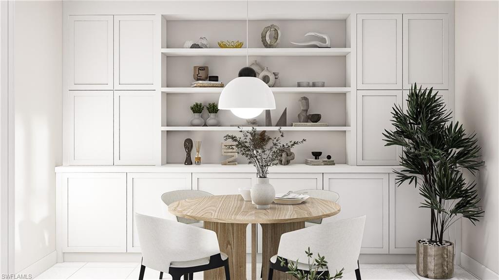 Dining space with light tile patterned flooring
