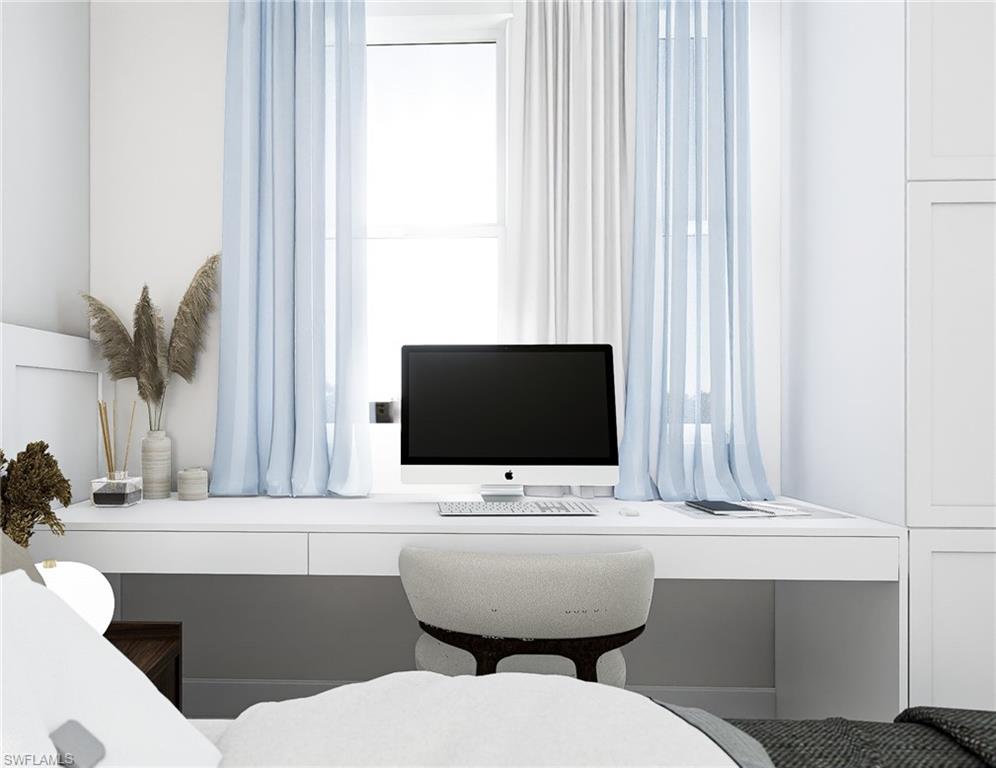 Office area featuring built in desk