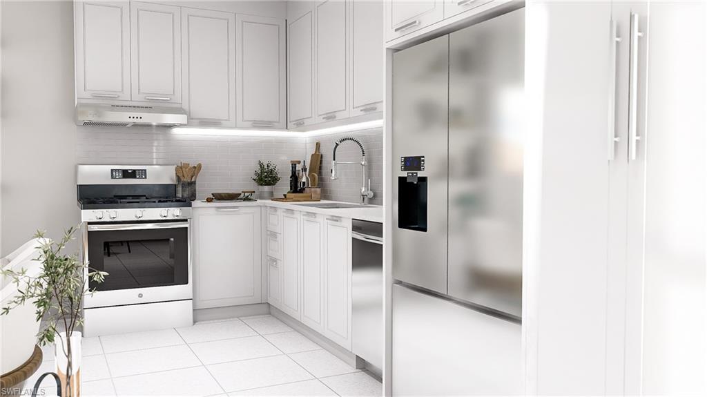 Kitchen with white cabinets, decorative backsplash, appliances with stainless steel finishes, light tile patterned floors, and light stone countertops