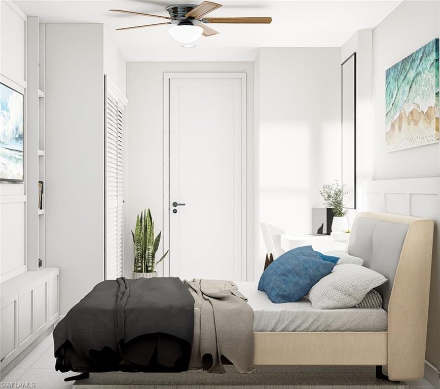 Bedroom with ceiling fan and a decorative wall