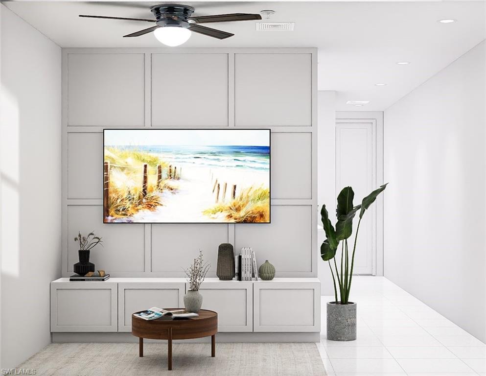 Living area featuring a decorative wall, light tile patterned floors, ceiling fan, and recessed lighting