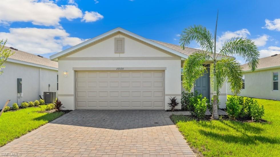Model Home - Single-story residence featuring a two-car garage with a paver driveway