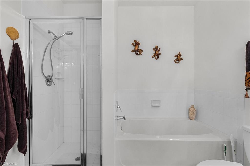 Bathroom with a garden tub and a stall shower