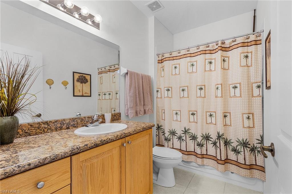Bathroom featuring vanity and light tile patterned floors