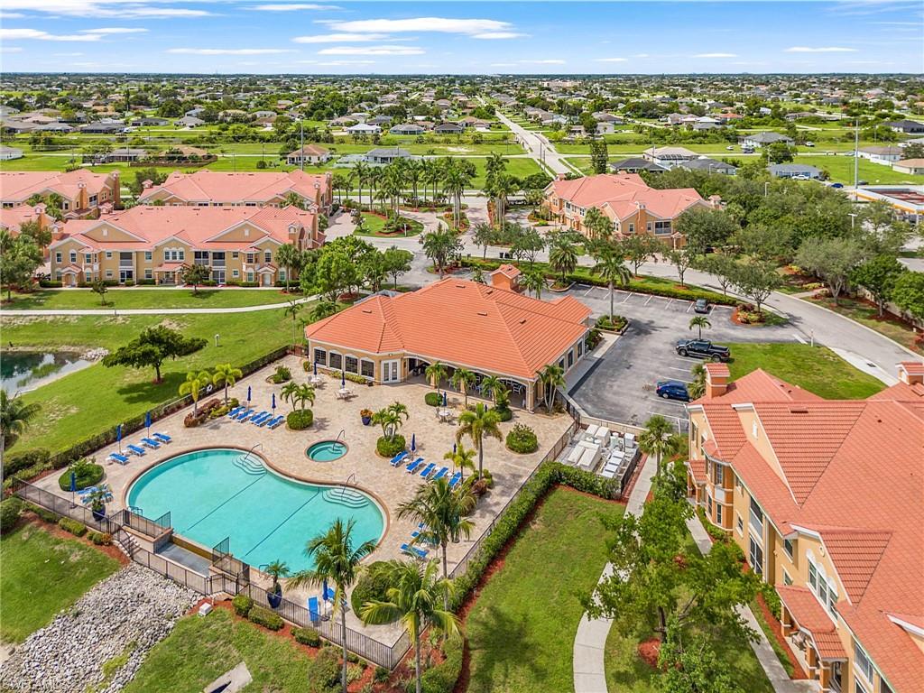 Aerial view of residential area featuring a pool area