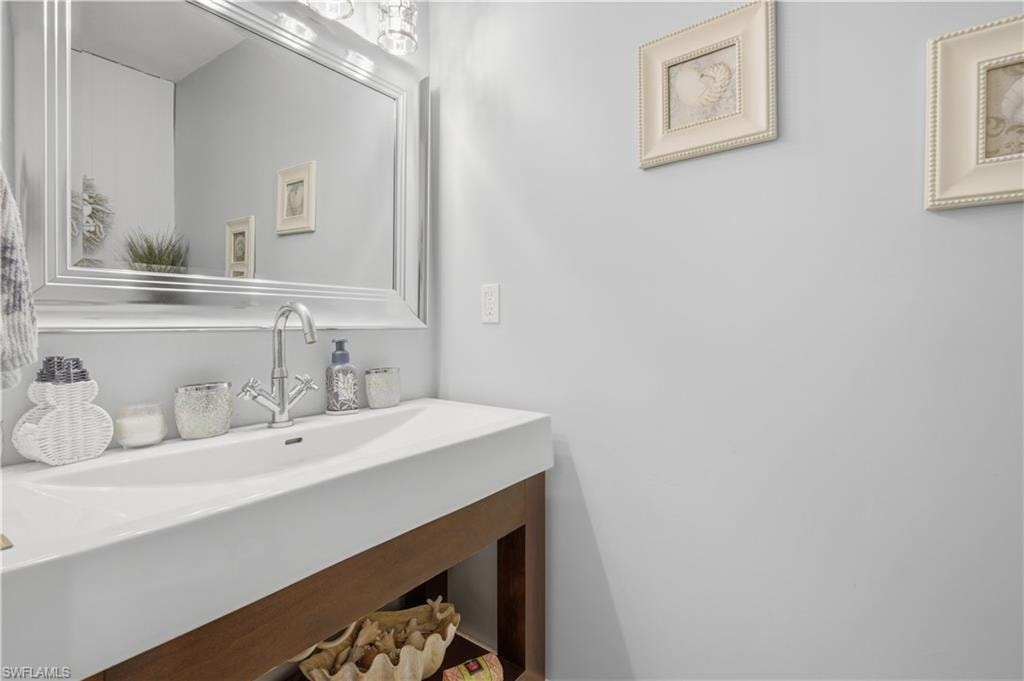 Integrated white rectangular sink with a chrome faucet